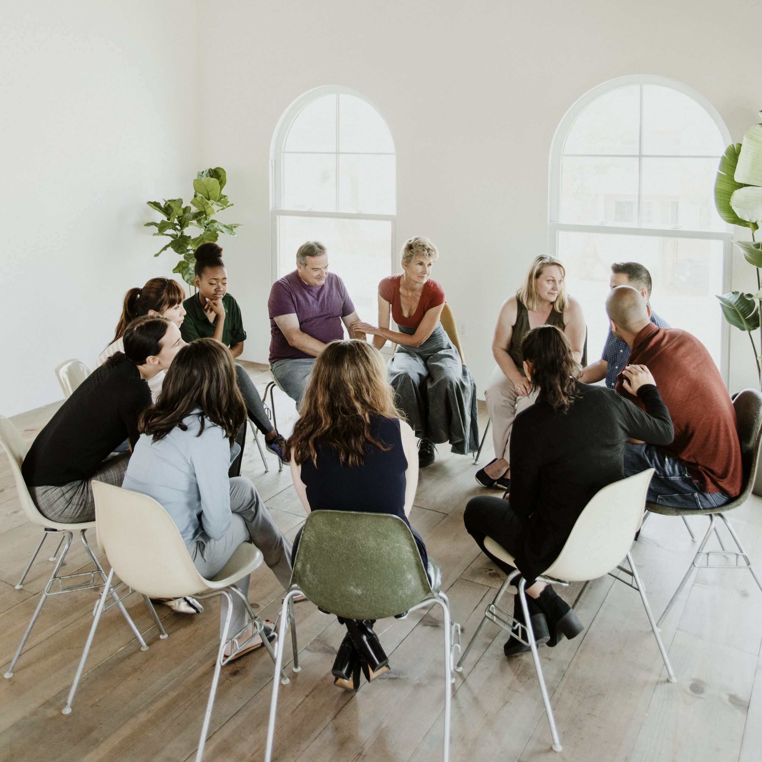 Diverse people in a support group session Diverse people in a support group session